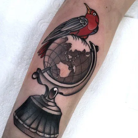 Globe tattoo on arm for women