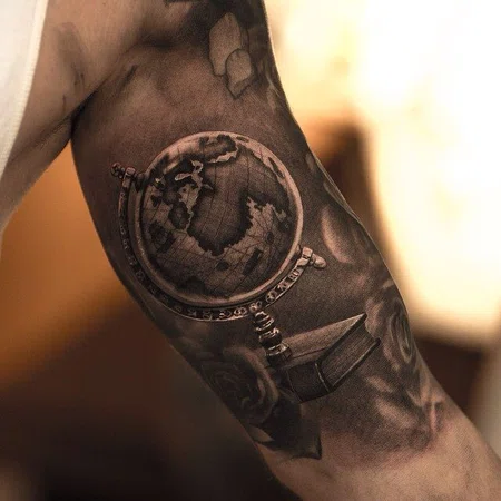 Globe tattoo on biceps for men