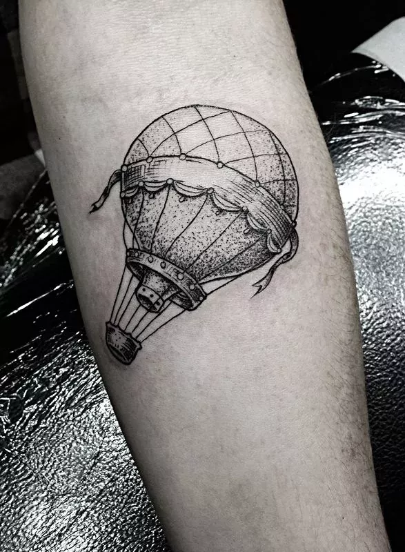 Balloon tattoo on the arm for men