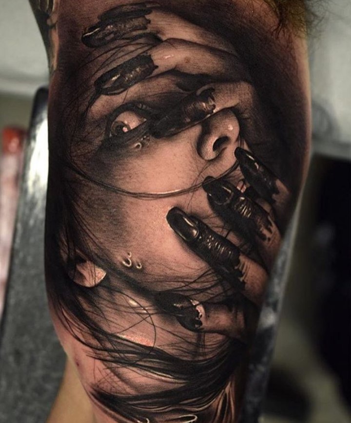 Horror style tattoo on the bicep for men