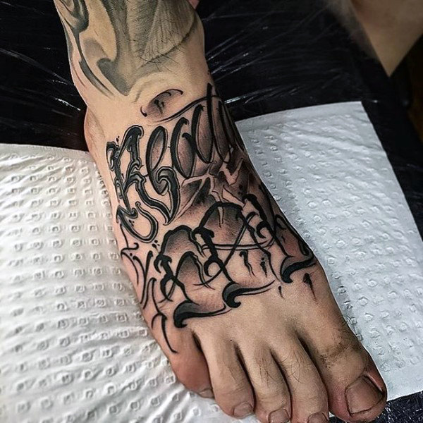 Lettering style ankle tattoo for men