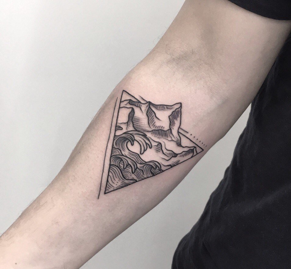 Mountain tattoo on forearm for men