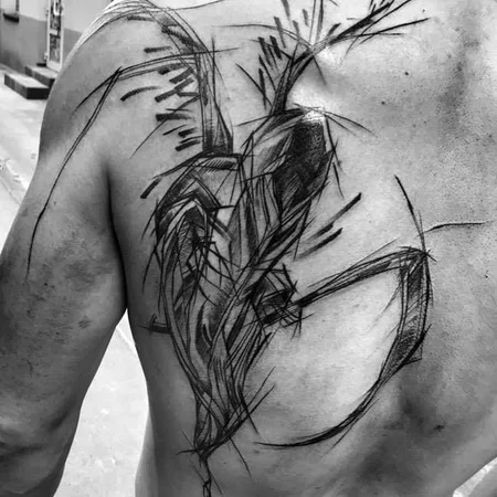 Sketch style tattoo on the shoulder blade for men