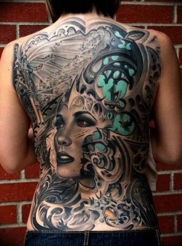 Fantasy style tattoo on the back for women