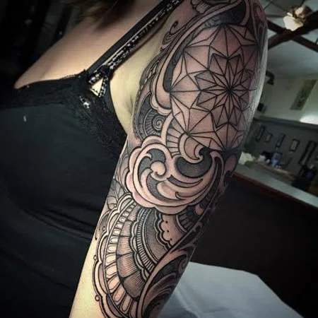 Ornamental style tattoo on the shoulder for women