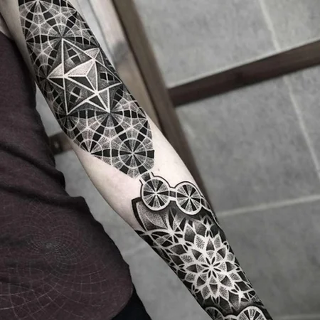 Ornamental style tattoo on the arm for men