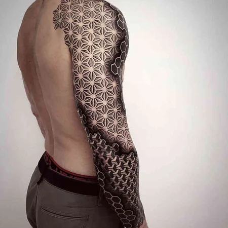 Ornamental style tattoo on the arm for men