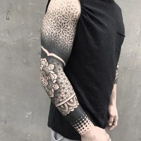 Ornamental style tattoo on the arm for men