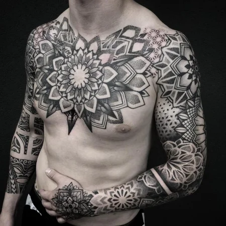 Ornamental style tattoo on the chest for men