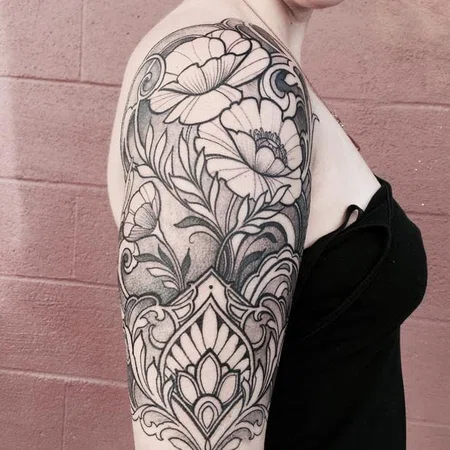 Ornamental style tattoo on the shoulder for women