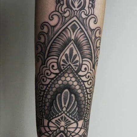 Ornamental style tattoo on the forearm for women