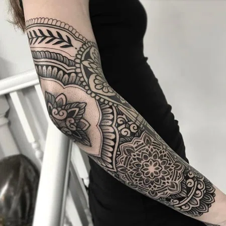 Ornamental style tattoo on the forearm for women