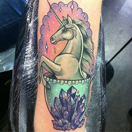 Unicorn tattoo on arm for women