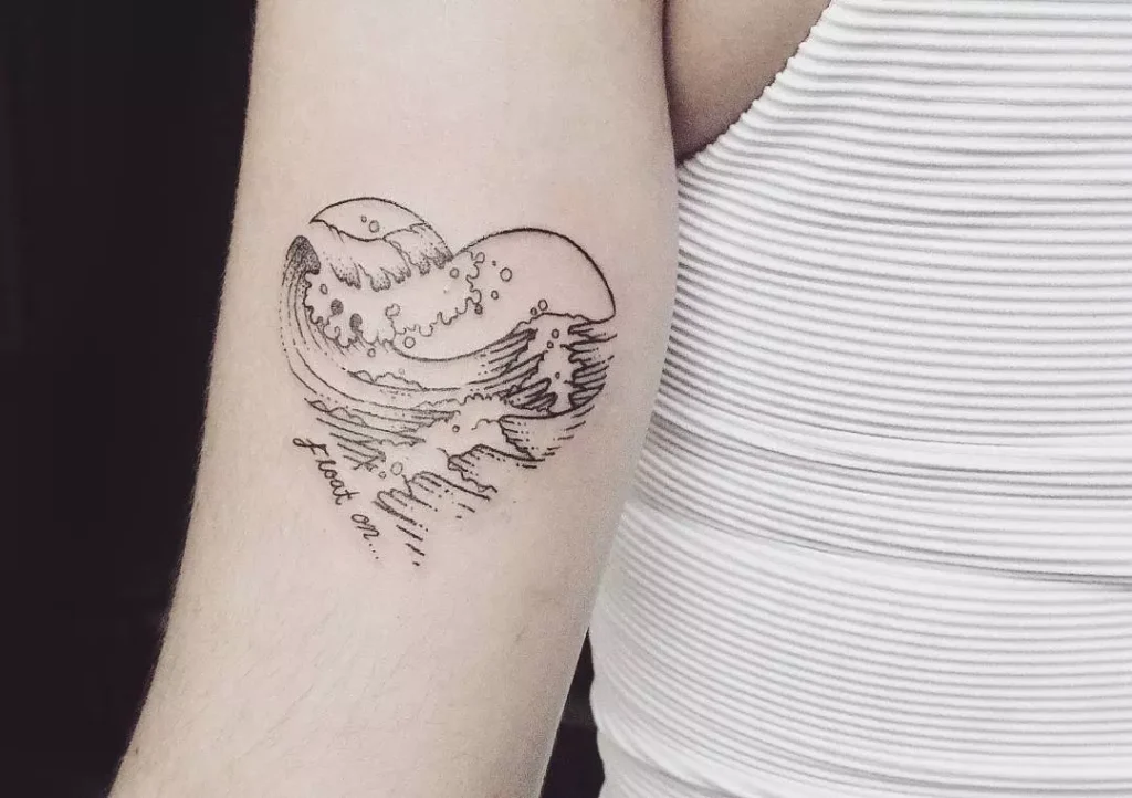 Wave tattoo on the shoulder for women