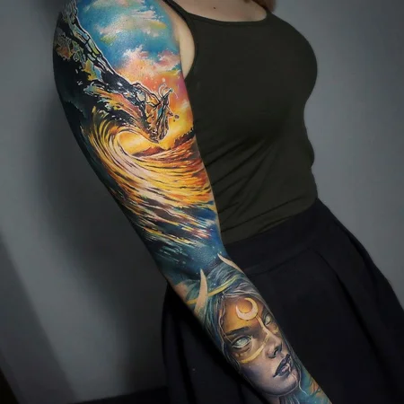 Large wave tattoo on the arm for women