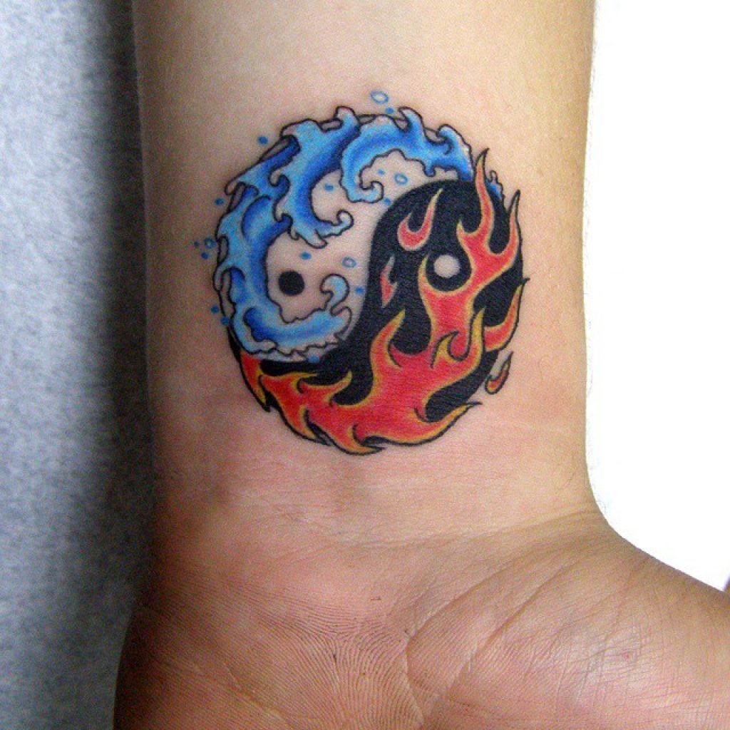 Yin-yang tattoo on the wrist for men