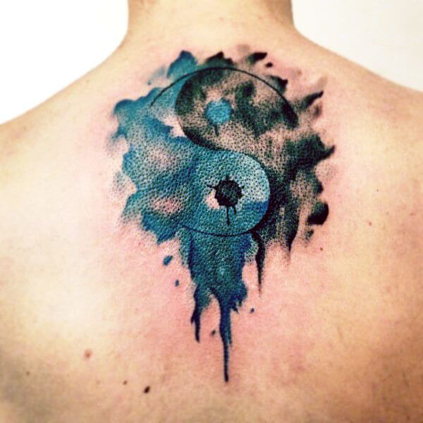 Yin-yang tattoo on back for men