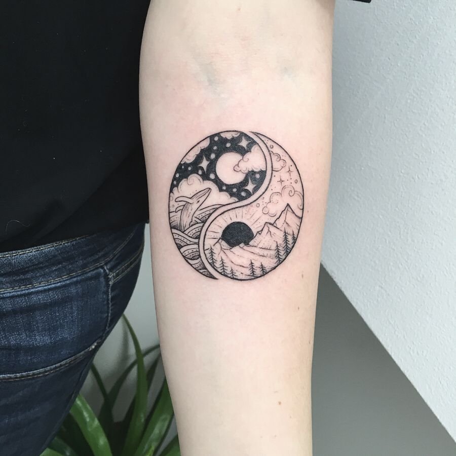 Yin-yang tattoo on forearm for women