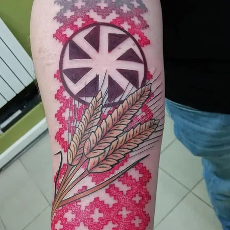 Kolovrat tattoo on arm for men