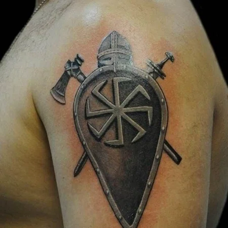 Kolovrat tattoo on the shoulder for men