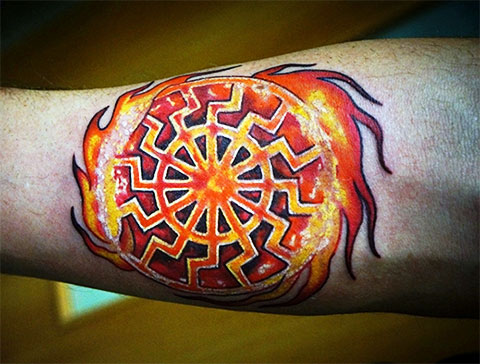 Kolovrat tattoo on arm for men