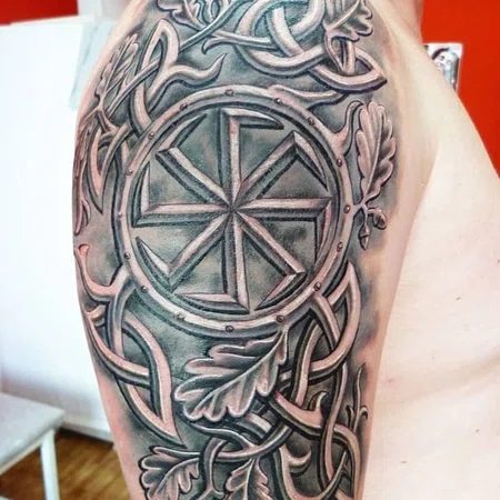 Kolovrat tattoo on the shoulder for men