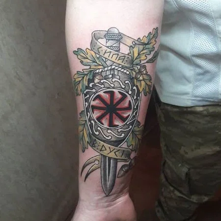 Kolovrat tattoo on the forearm for men