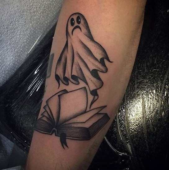 Book tattoo on forearm for men