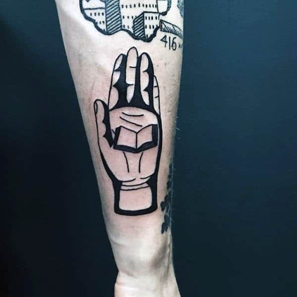 Book tattoo on the arm for men