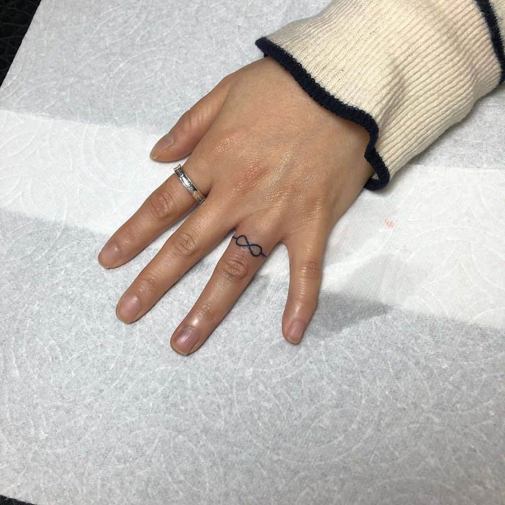 Finger ring tattoos for women