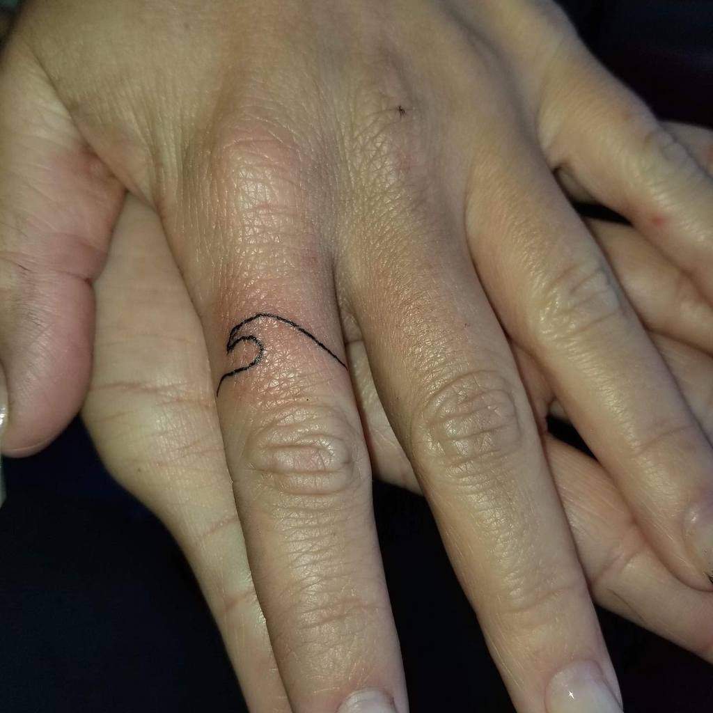 Finger ring tattoos for women