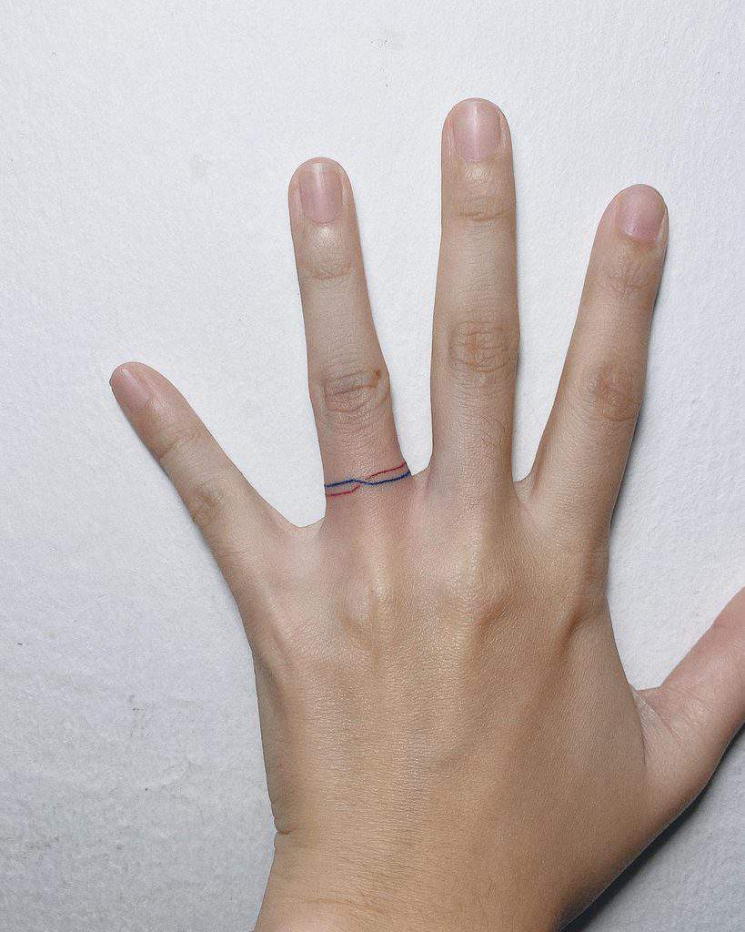 Colorful ring tattoo on finger for women