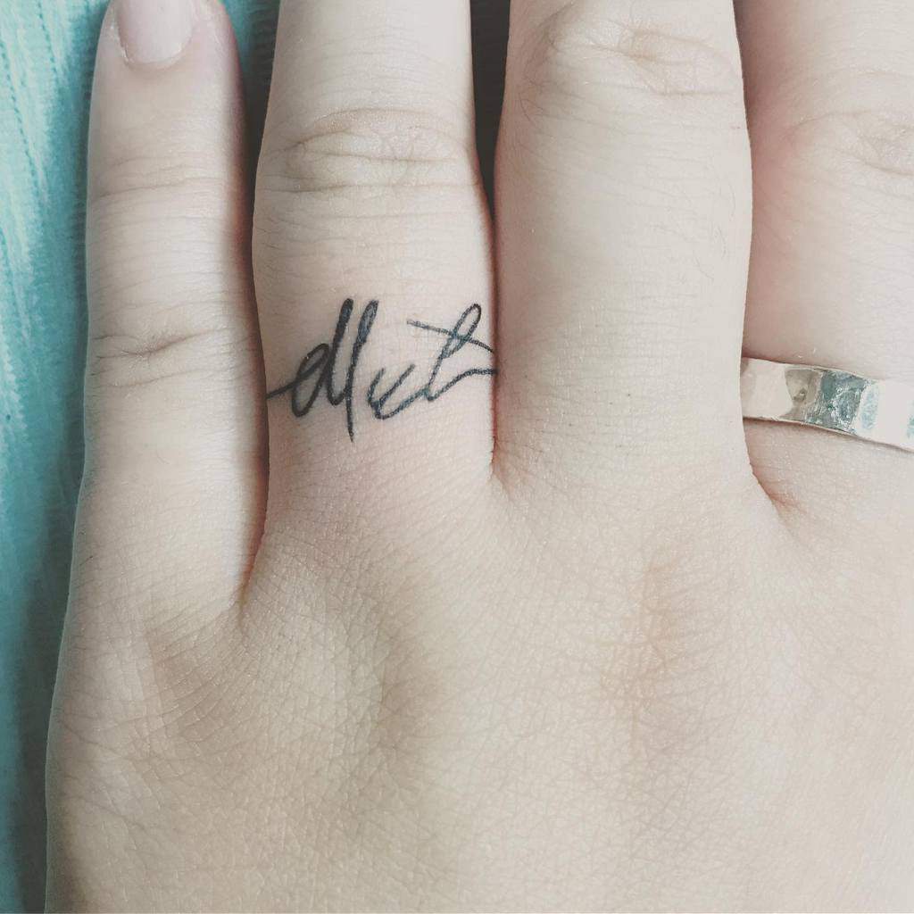 Finger ring tattoos for women