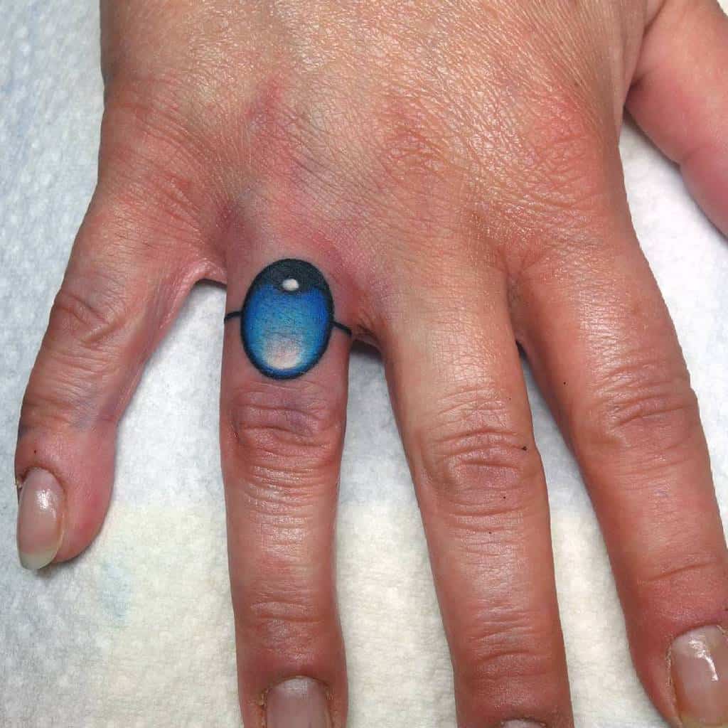 Colorful ring tattoo on finger for women