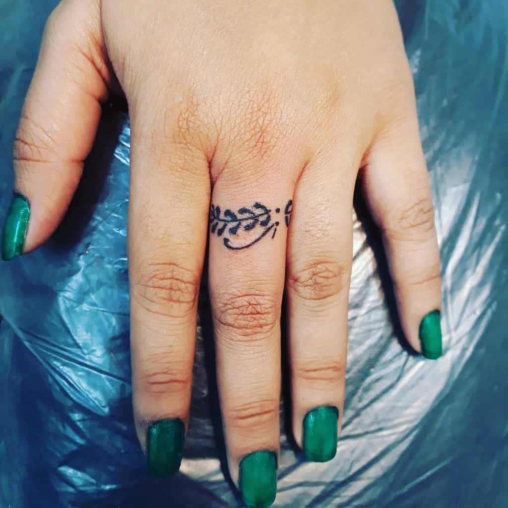 Finger ring tattoos for women