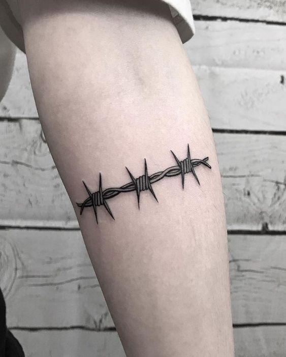 Barbed wire tattoo on forearm for men