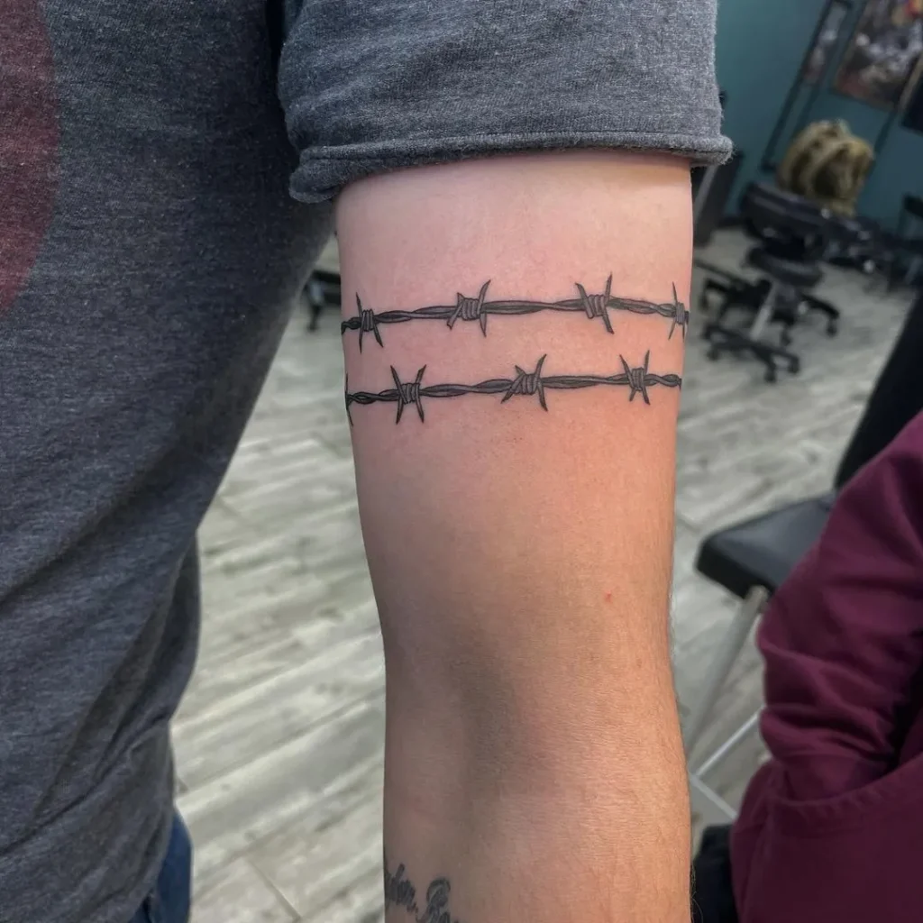 Barbed wire tattoo on shoulder for men