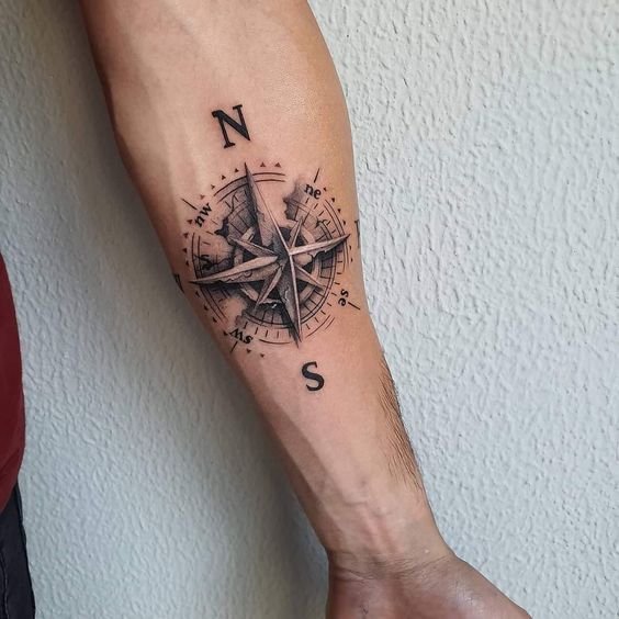 Compass tattoo on forearm for men