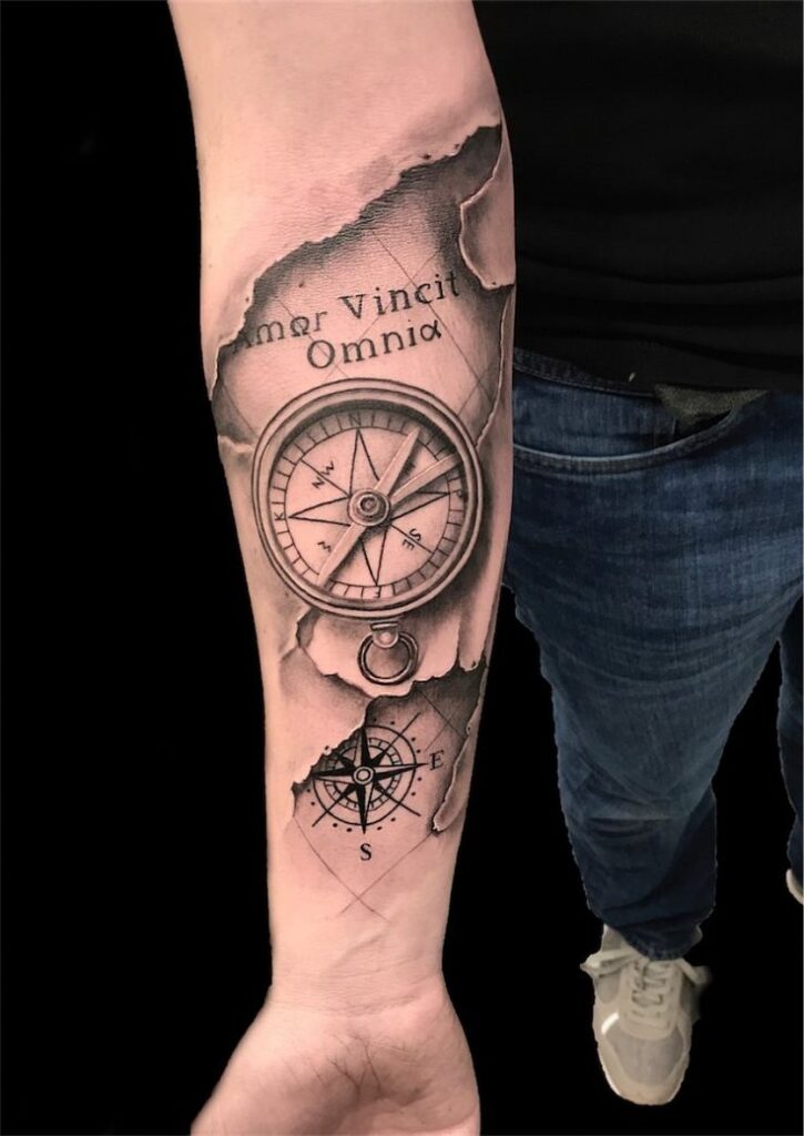 Compass tattoo on forearm for men