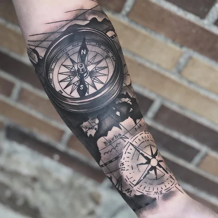 Large compass tattoo on forearm for men