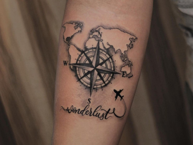 Compass tattoo on forearm for men