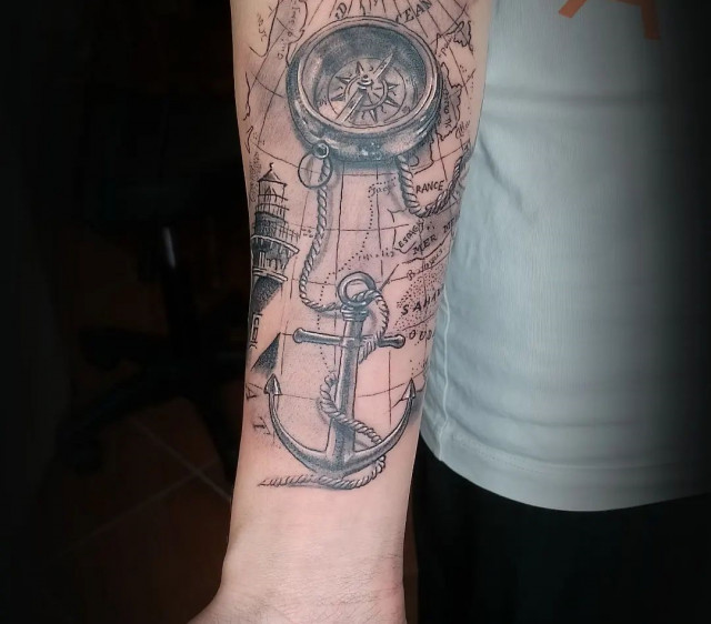 Compass tattoo on the arm for men