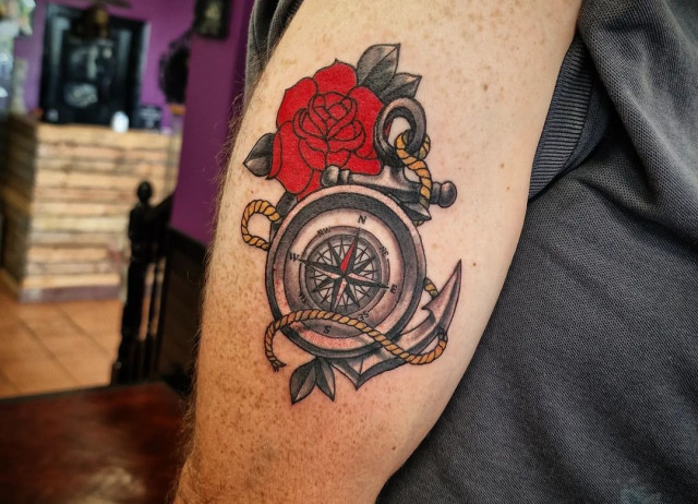 Compass and rose tattoo on forearm for men