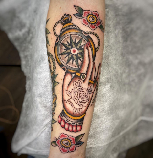 Compass tattoo on the arm for men