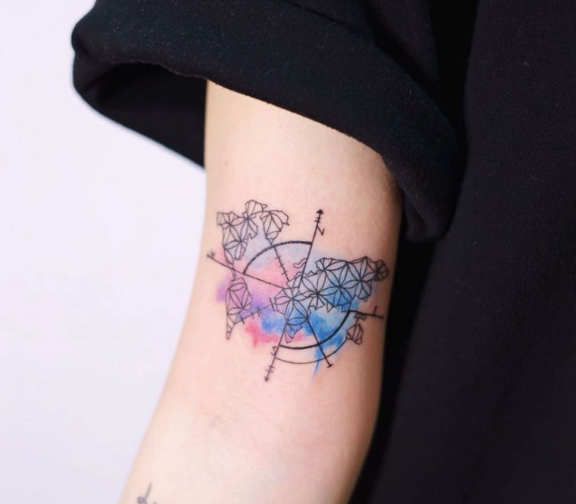 Colorful compass tattoo on shoulder for women