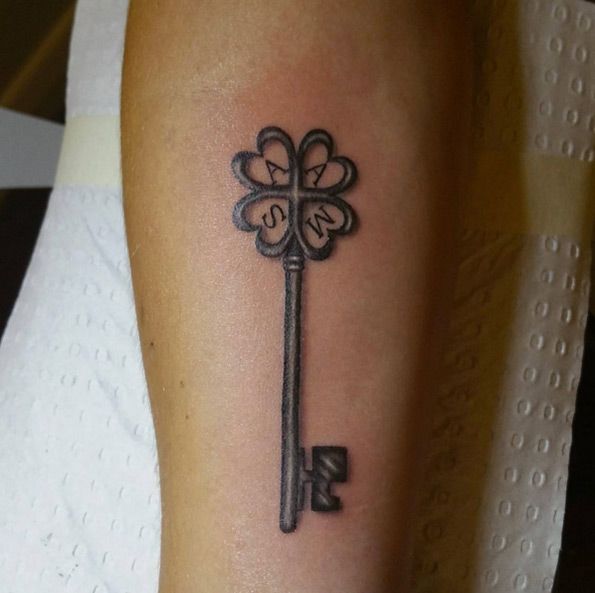 Key tattoo on forearm for women