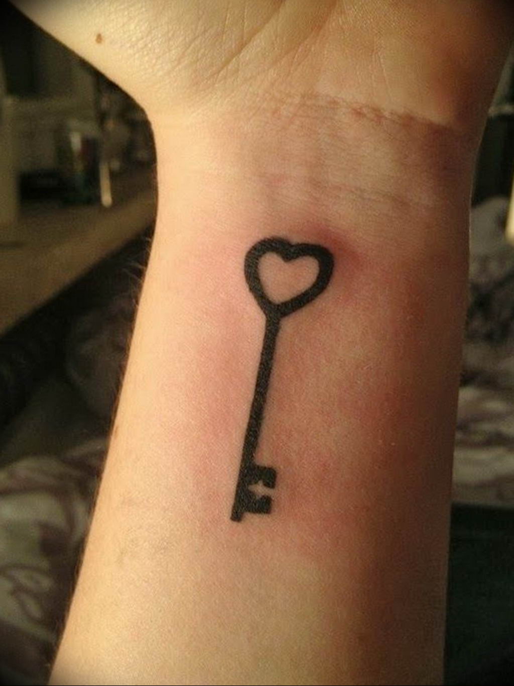 Wrist key tattoo for women