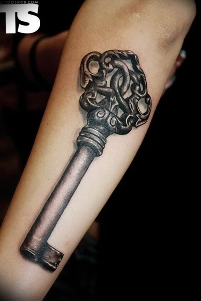 Key tattoo on the arm for men