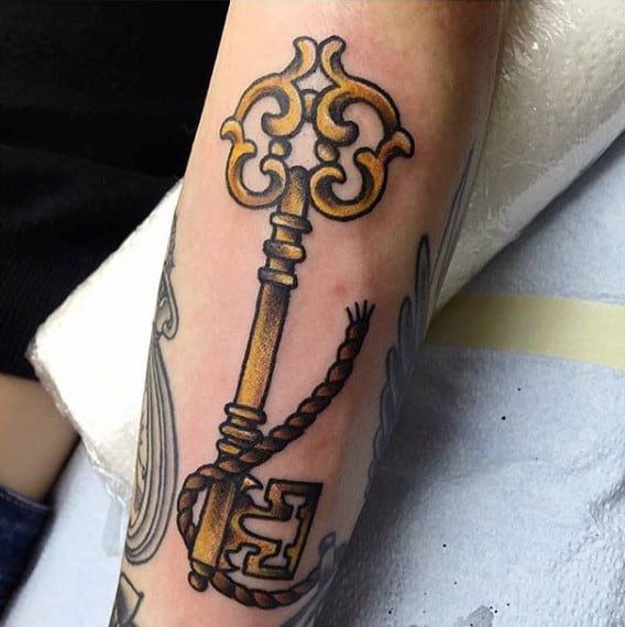 Key tattoo on the arm for men