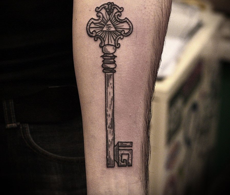 Key tattoo on forearm for men